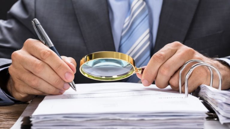 Ontario business owner examining master business license requirements and incorporation papers