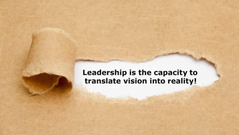 Torn paper revealing leadership quote about translating vision into reality for second business startup