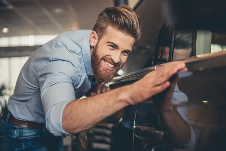 Smiling man starting a car repair business, a potential user case for a Master Business Licence.