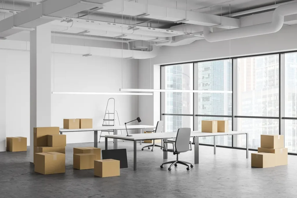 Empty office with moving boxes and packed furniture during Ontario corporation dissolution process