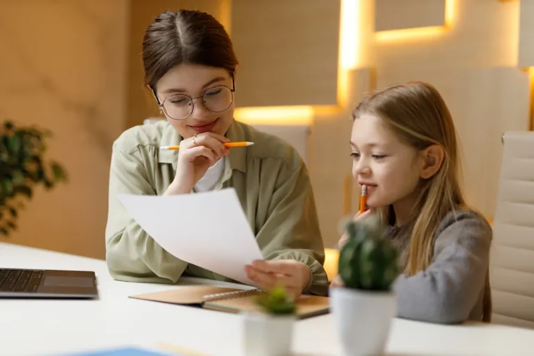 young woman tutoring a girl
