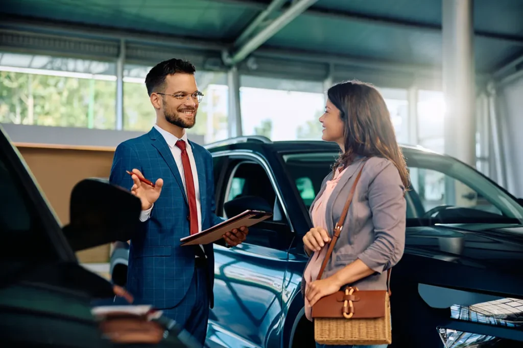 Business owner registering new company vehicle with automotive professional in Ontario