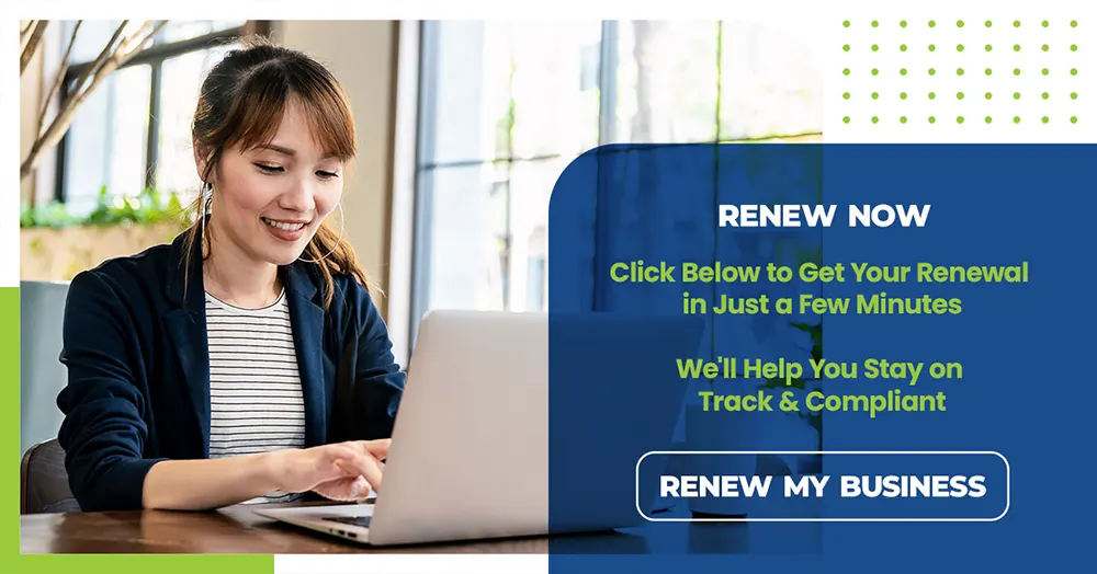 Person using a laptop to renew a business registration online with Ontario Business Central