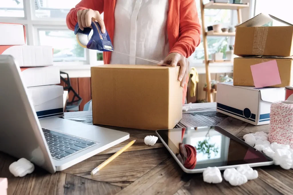 Business address change and relocation checklist—owner packing boxes and updating records.