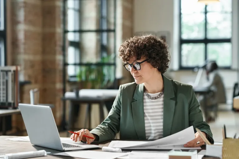 Canadian entrepreneur reviewing corporate documents showing current directors of a corporation