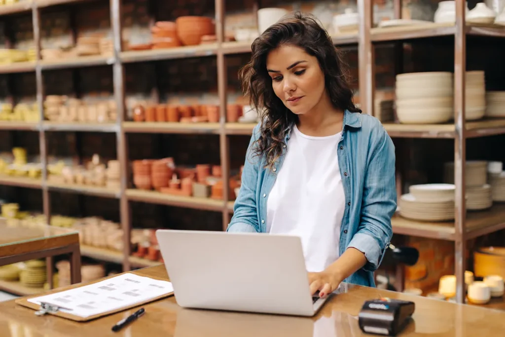 Canadian business owner reviewing documents for Helcim merchant account verification