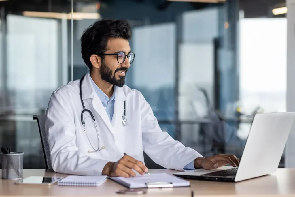 Doctor using laptop to order corporate search for professional corporation registration online