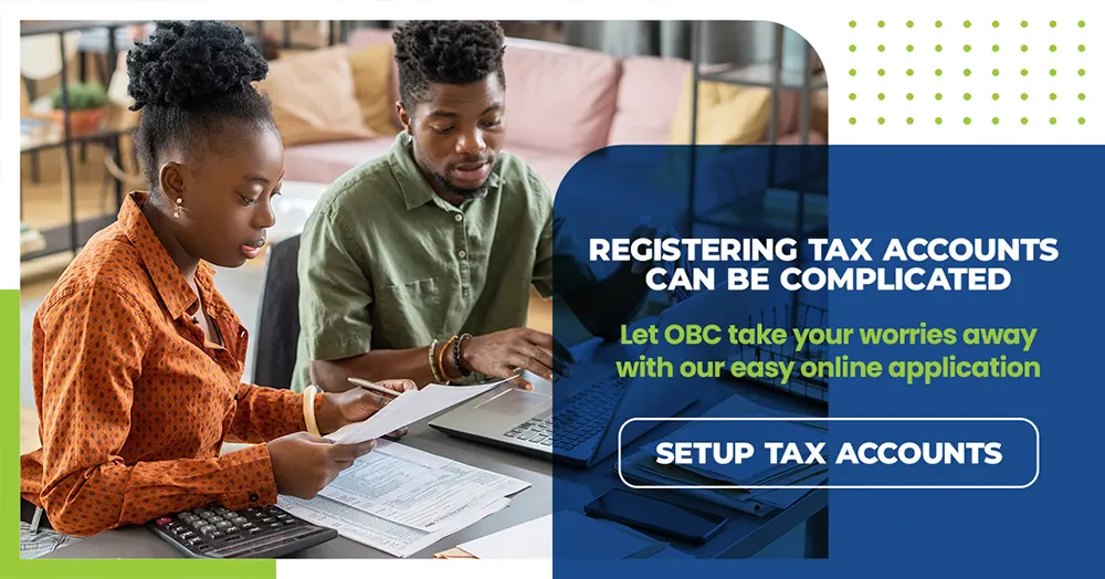 Two business owners reviewing tax documents with calculator - OBC online tax account registration service