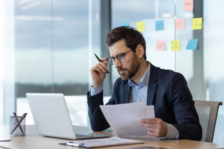 Business owner reviewing Ontario corporation documents while deciding between numbered and named incorporation