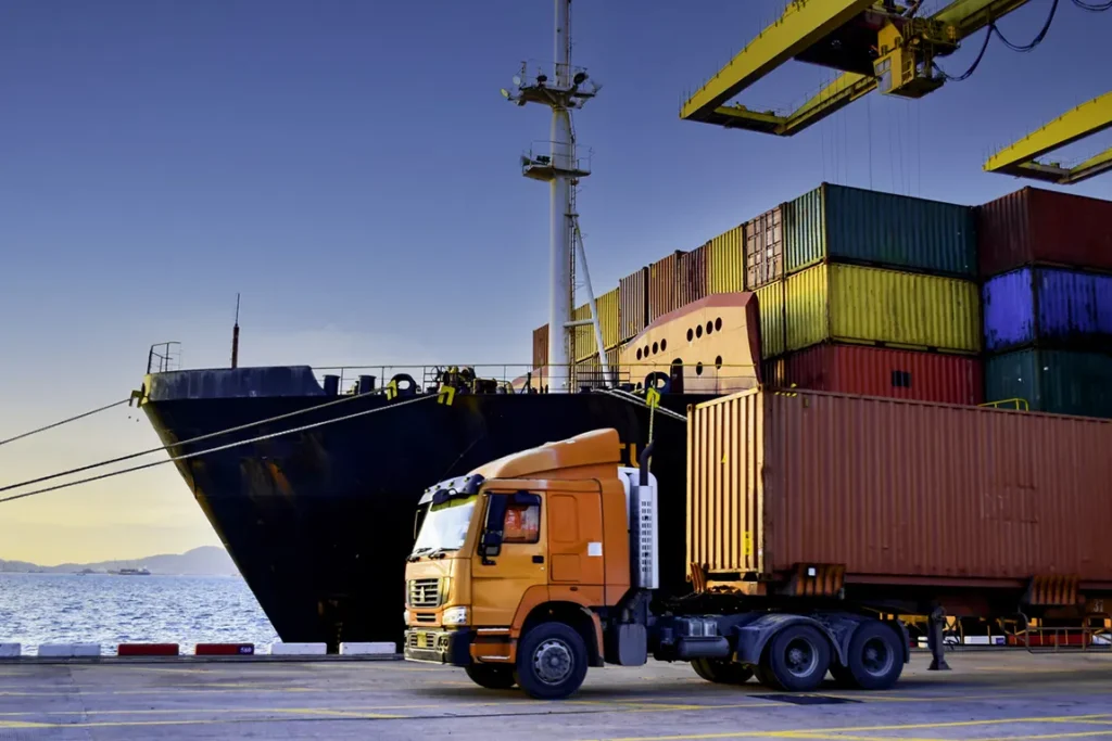Cargo ship and shipping containers at Canadian port for import export customs clearance