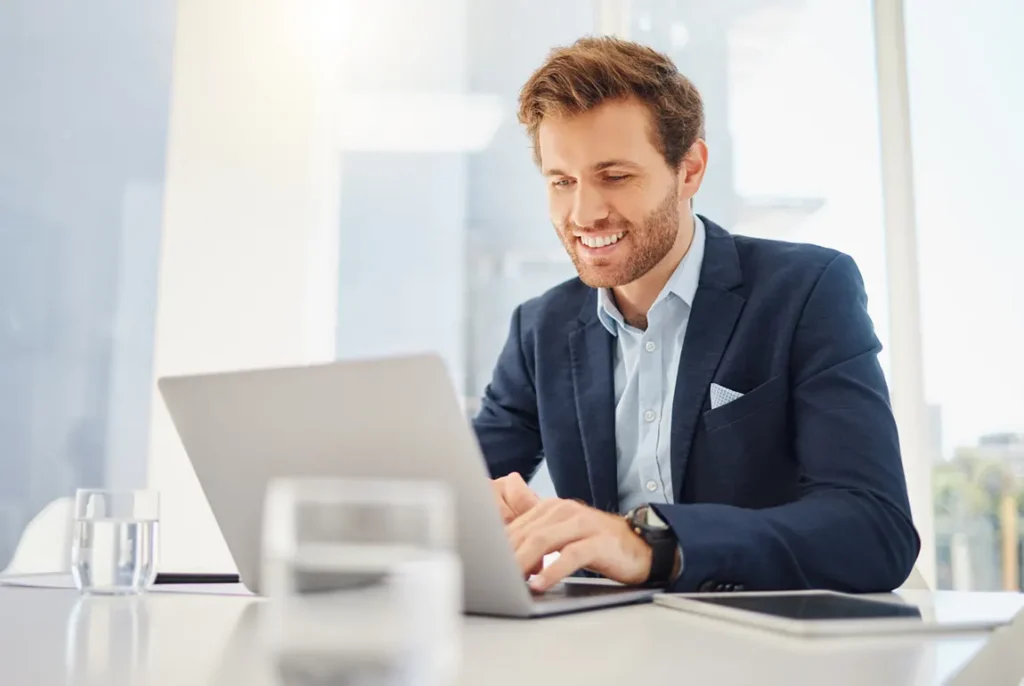 Business owner reviewing documents online to change a corporation name in Ontario