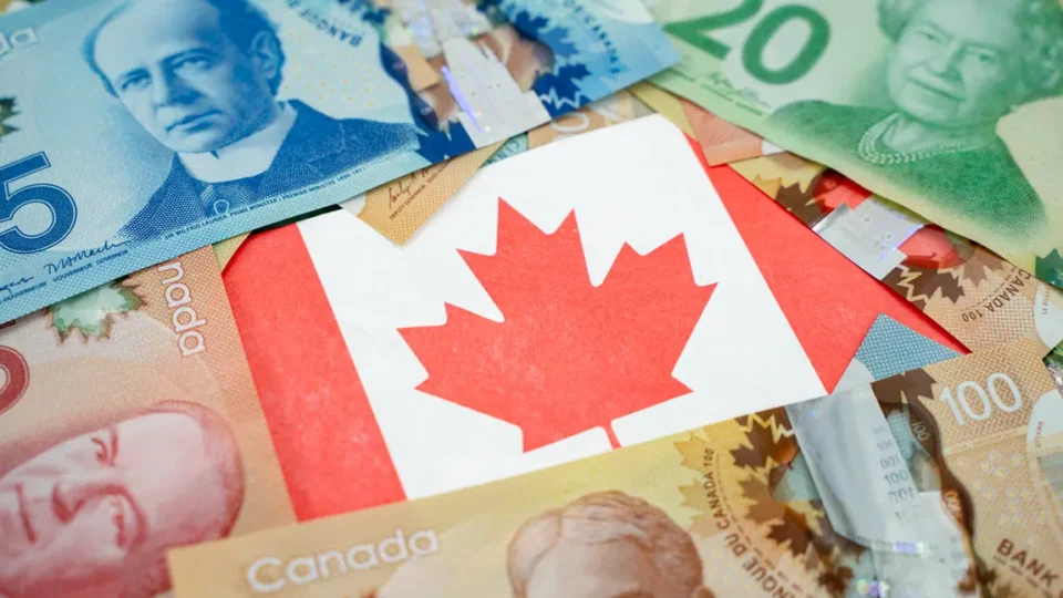 Canadian dollar bills with maple leaf flag representing extra income and side hustle earnings in Canada