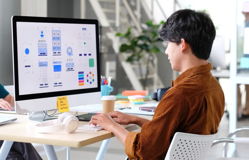 Freelance web designer working on UI UX project as remote side hustle in Canada