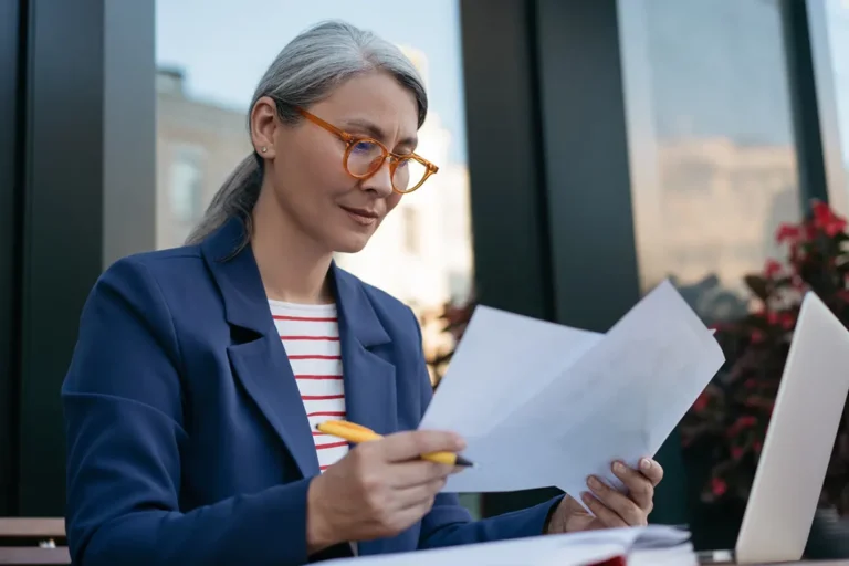 Professional reviewing corporate documents for Ontario corporation reinstatement and compliance